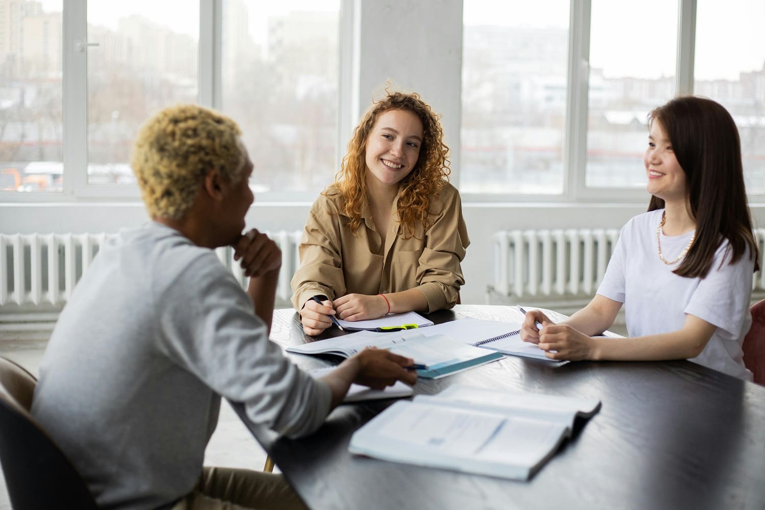 A group of people sitting around a table.